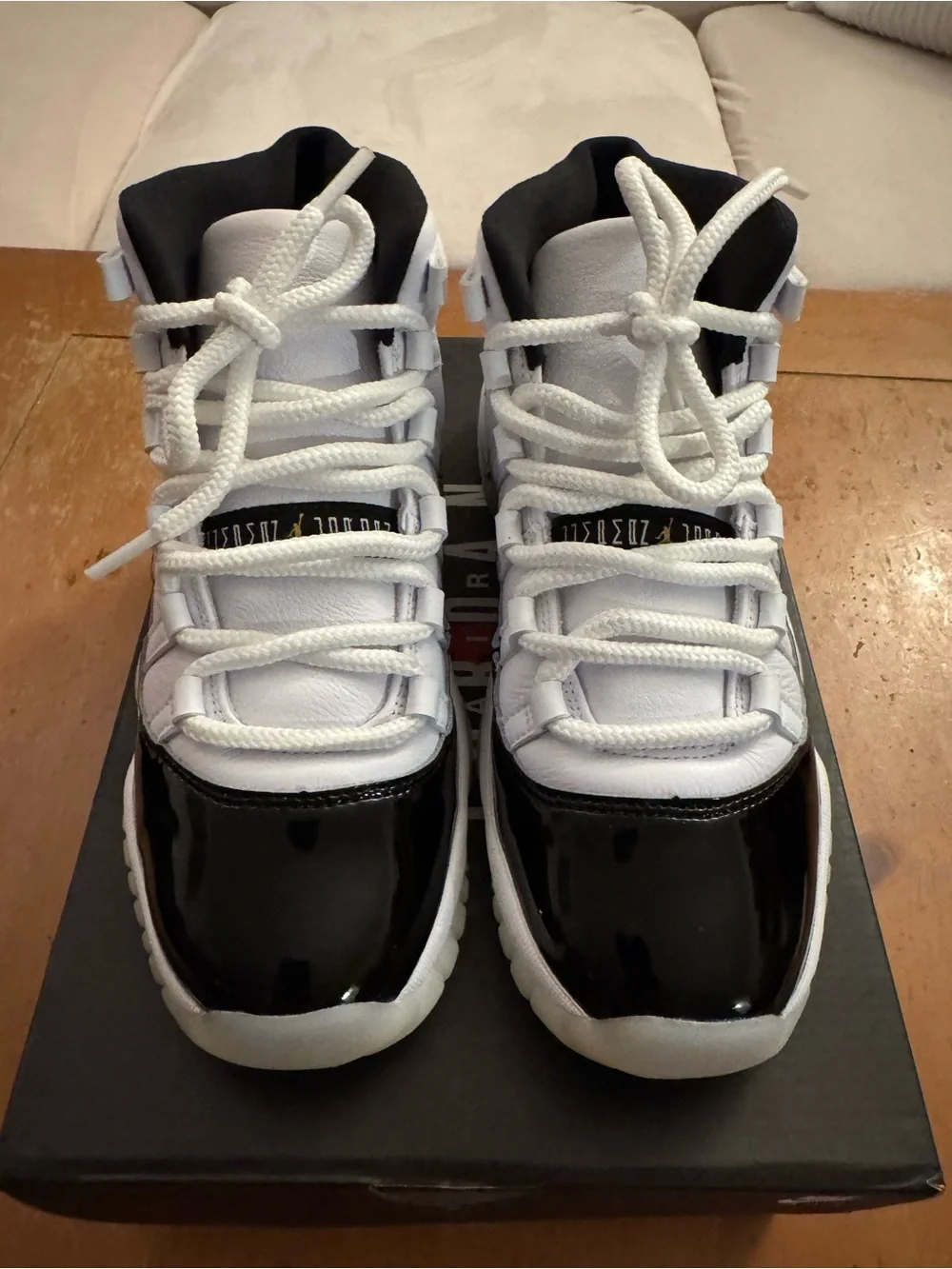 Air Jordan 11 Retro (GS) Big Kid’s Sneakers in White and Patent Black